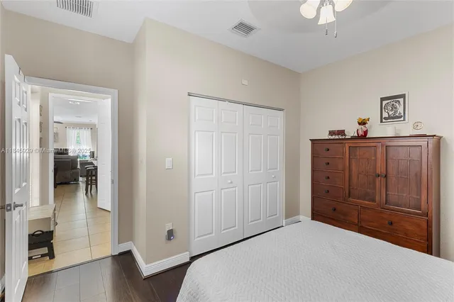 a room with a dresser and mirror