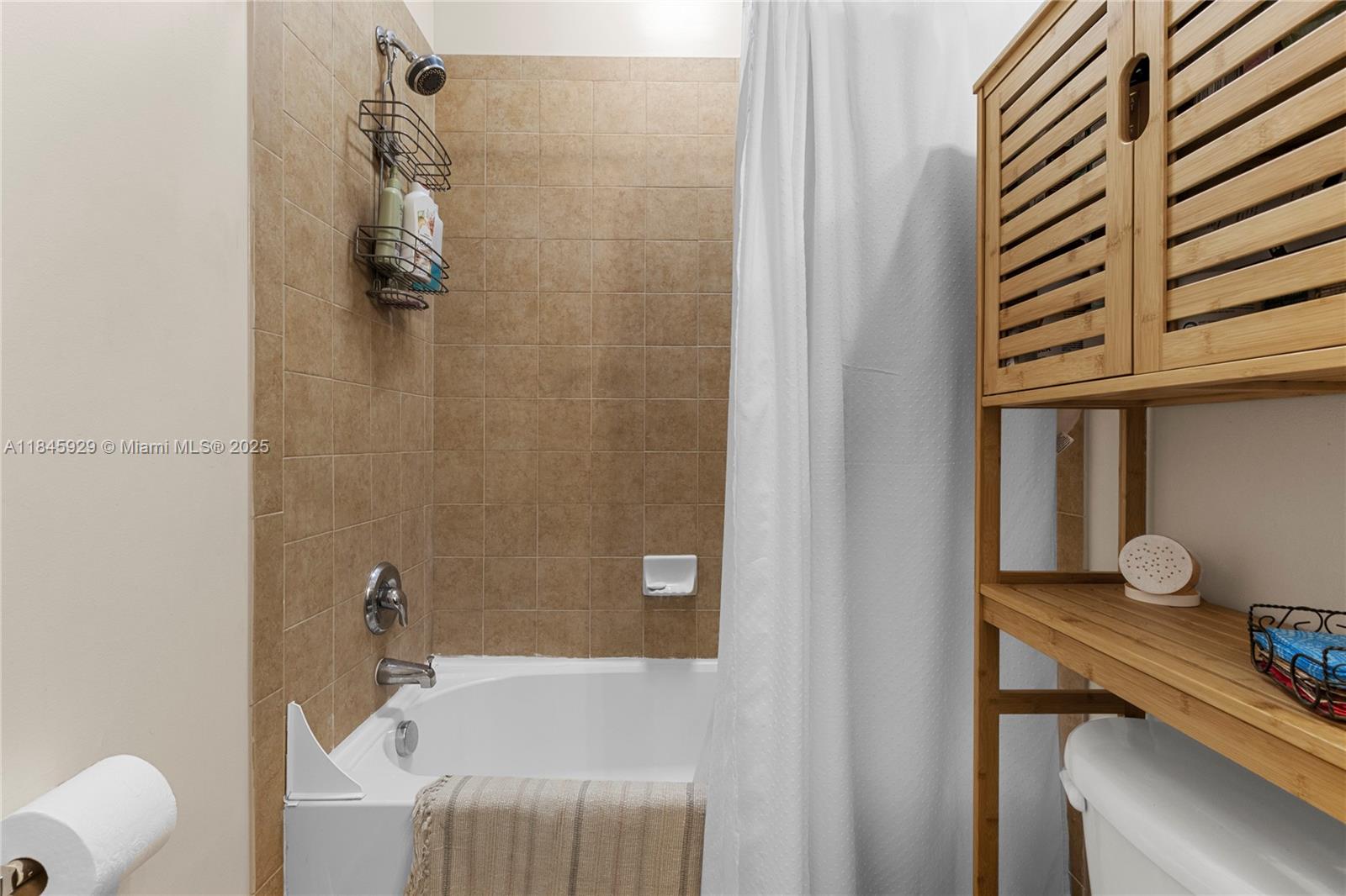 1112 Southwest 146th Terrace Pembroke Pines, FL 33027 - Photo 17 of 42 a bathroom with a sink and a bathtub