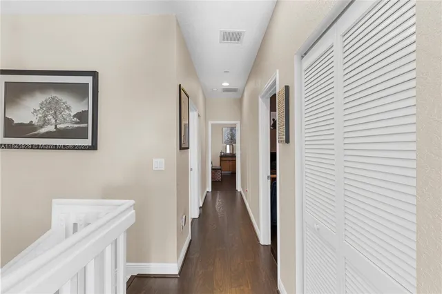 a view of a hallway with a white walls