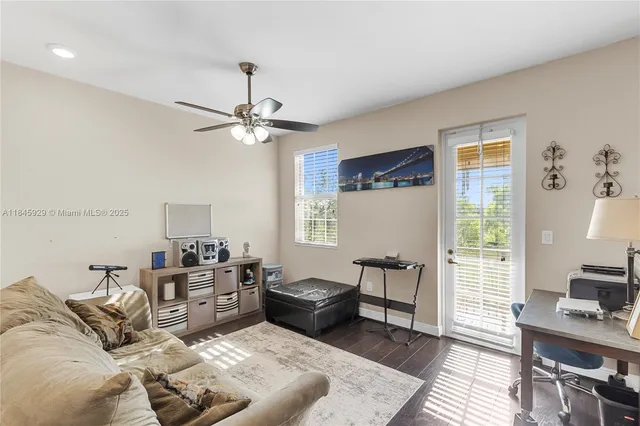 a living room with furniture and a window