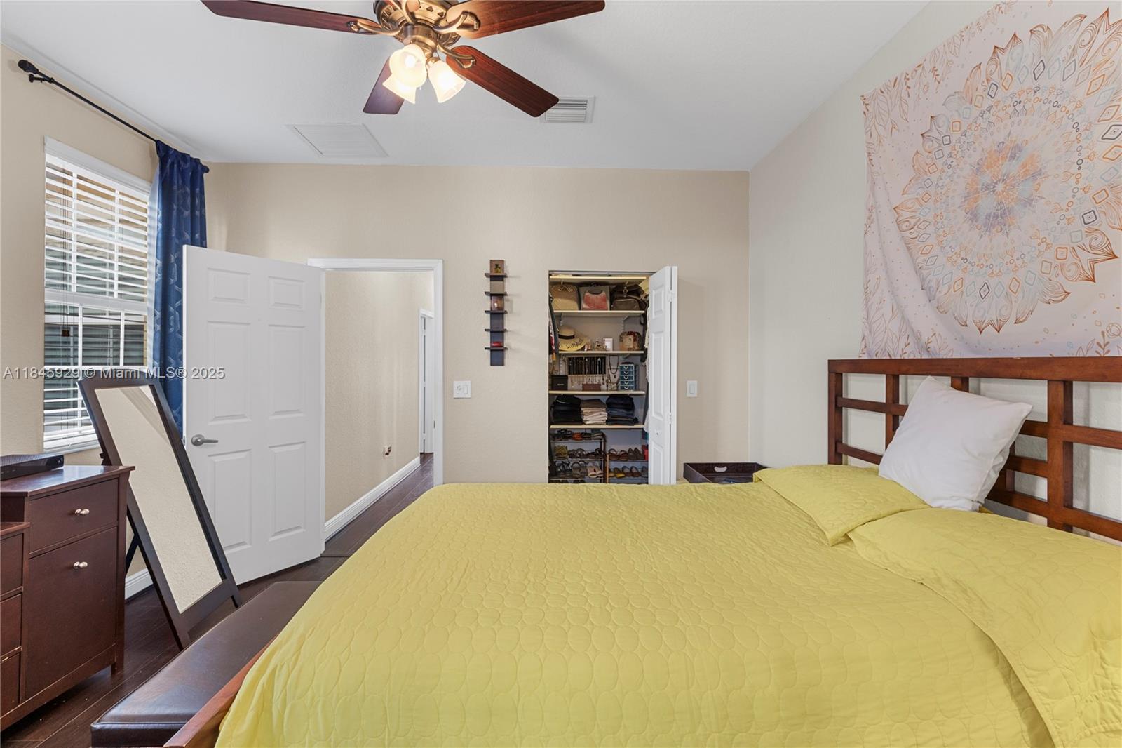 1112 Southwest 146th Terrace Pembroke Pines, FL 33027 - Photo 25 of 42 a bedroom with a bed and a window