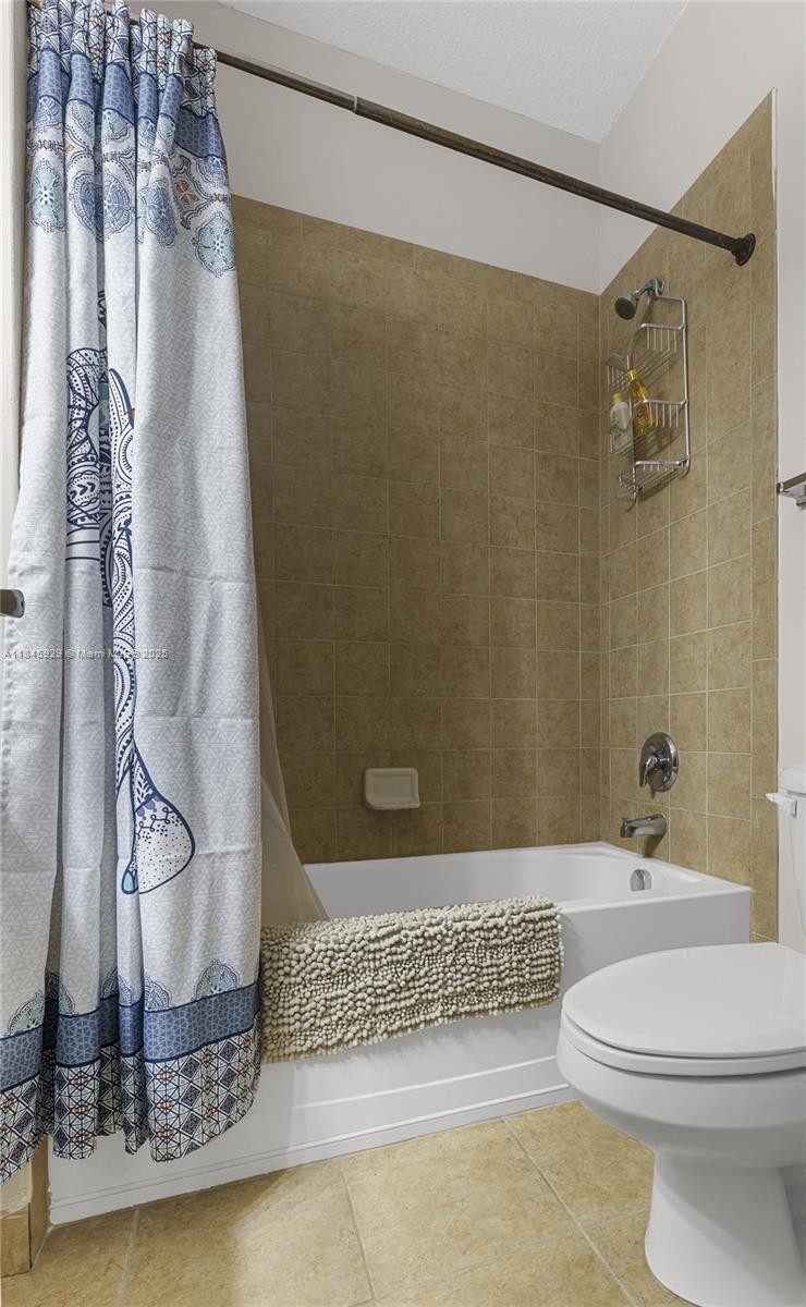 1112 Southwest 146th Terrace Pembroke Pines, FL 33027 - Photo 33 of 42 a bathroom with a sink a toilet and shower