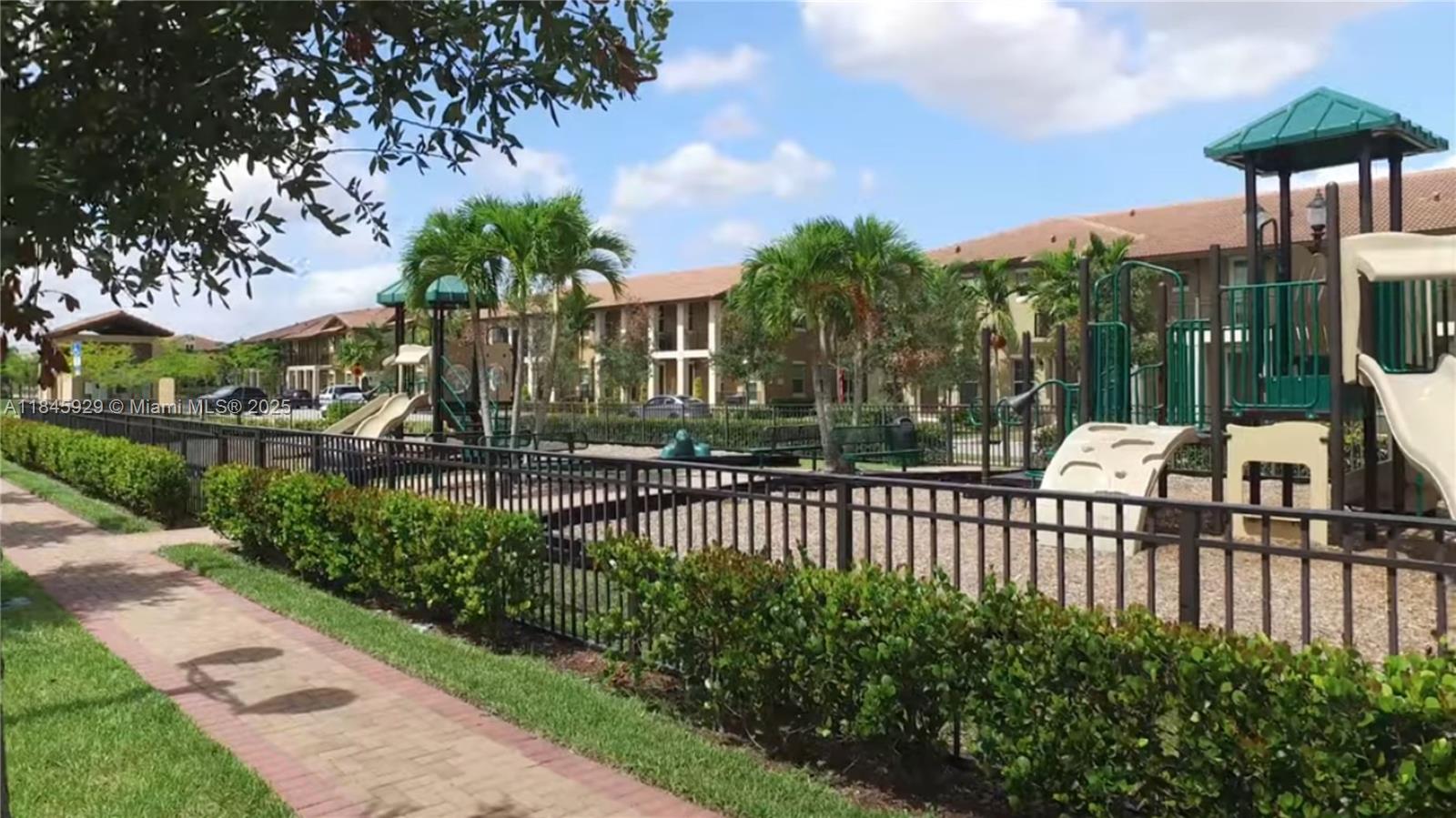 1112 Southwest 146th Terrace Pembroke Pines, FL 33027 - Photo 40 of 42 a view of a garden with a flower garden