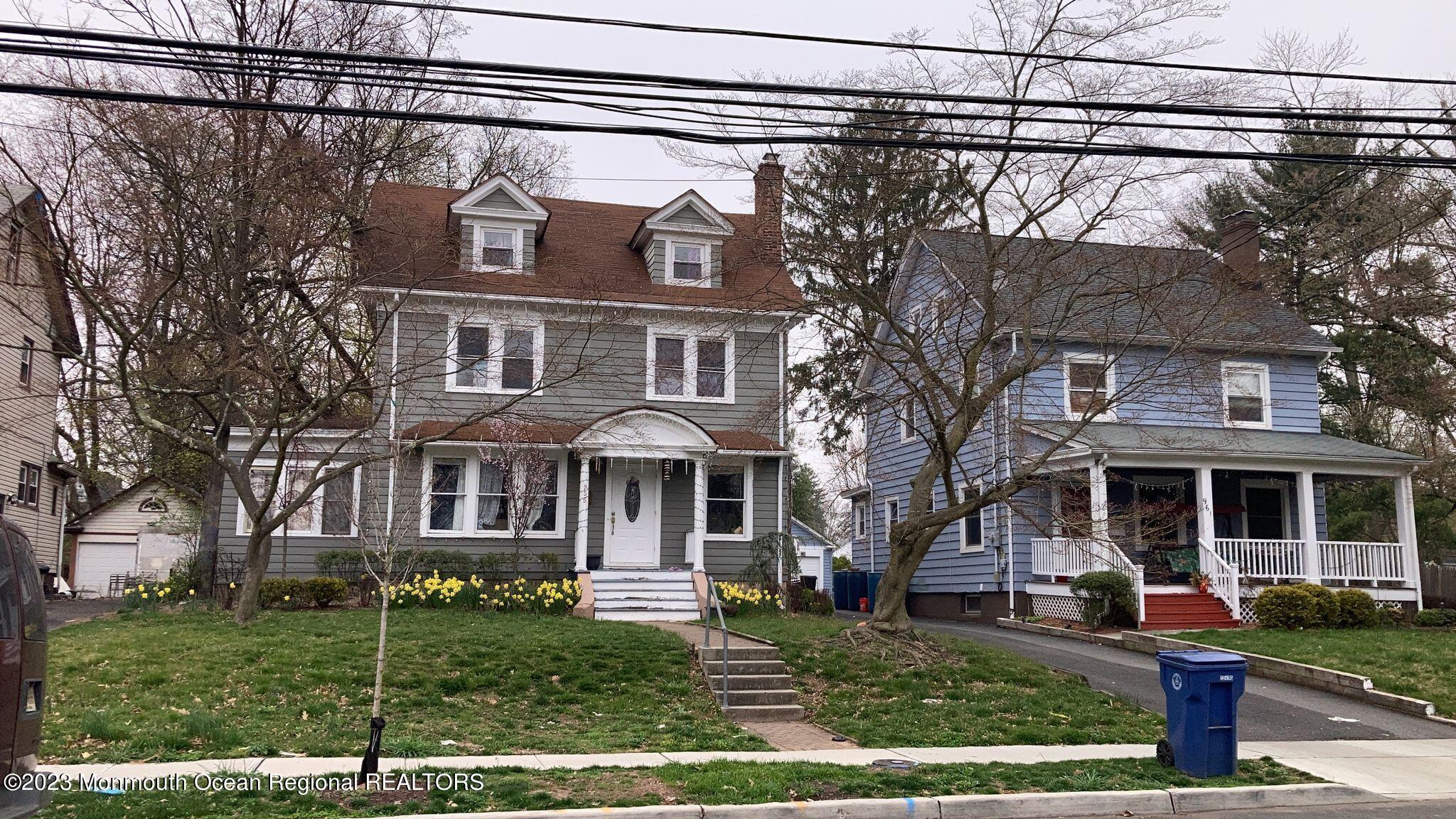 955 Prospect Avenue Plainfield, NJ 07060 - Photo 1 of 2 a front view of a house with a yard table and chairs