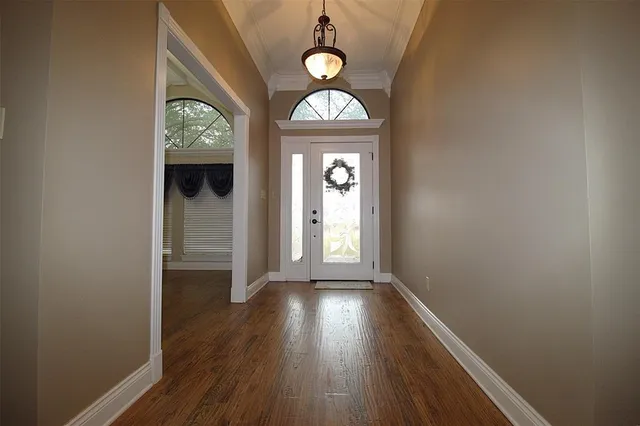 a view of entryway with wooden floor