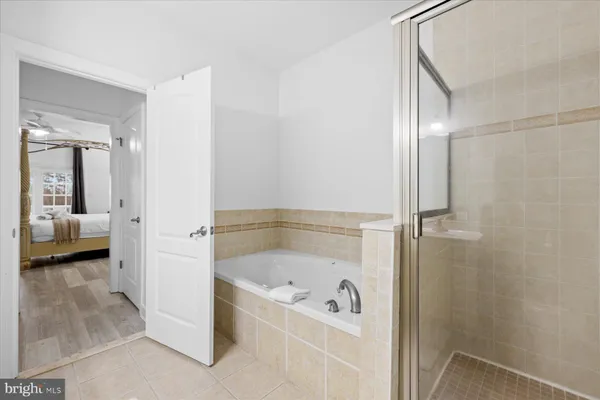 a bathroom with a tub and shower