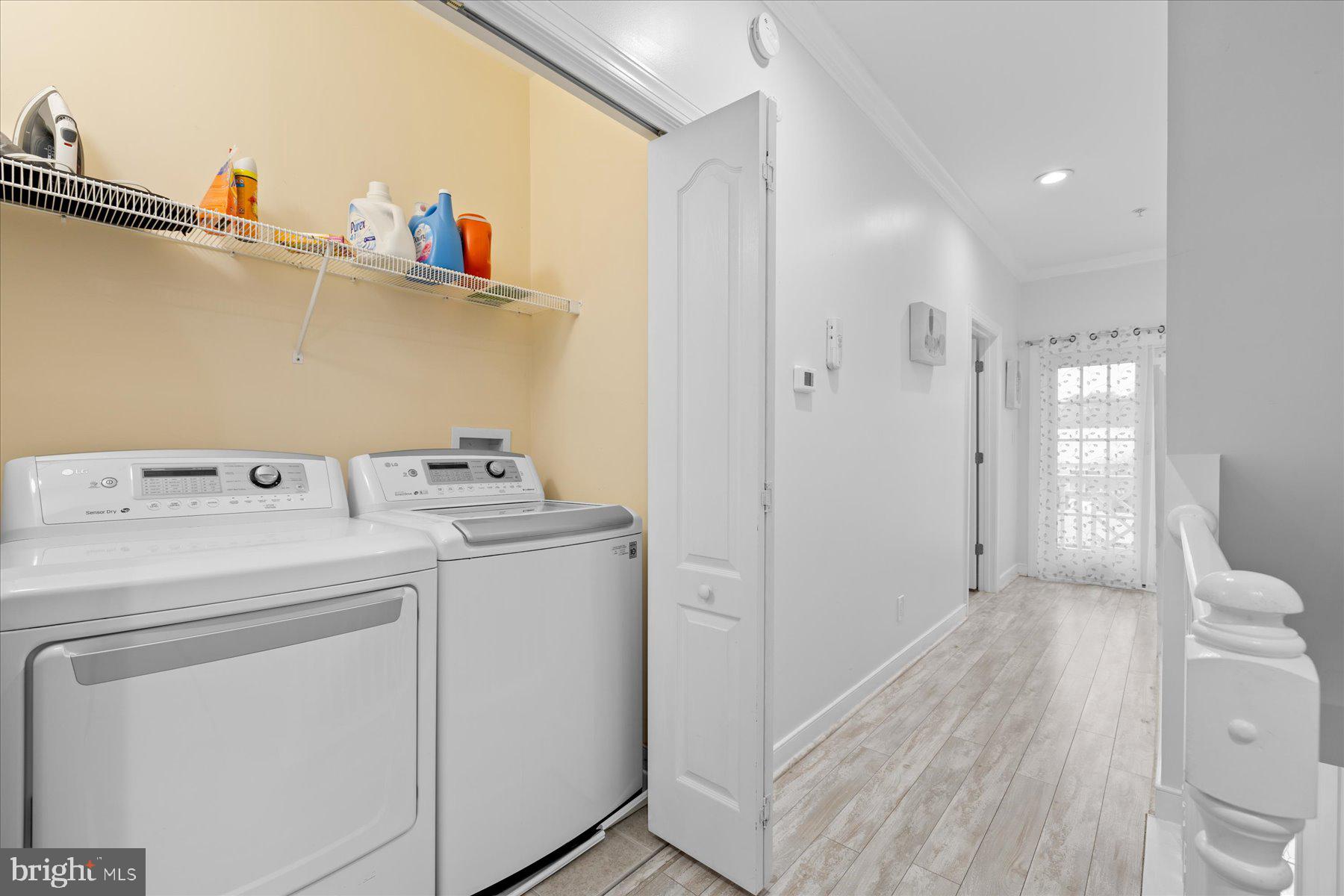 9823 Golf Course Road, Unit 10 Ocean City, MD 21842 - Photo 16 of 40 a utility room with dryer and washer