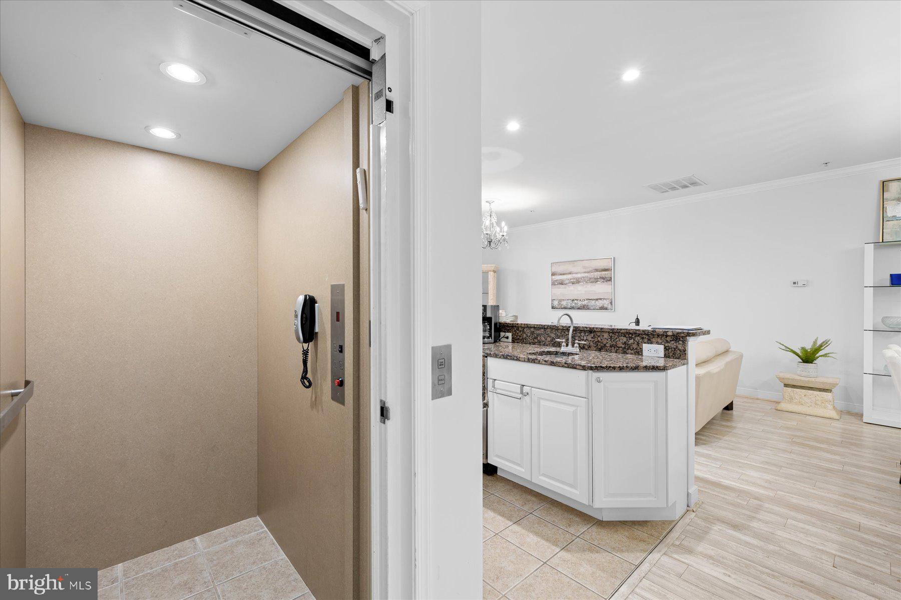 9823 Golf Course Road, Unit 10 Ocean City, MD 21842 - Photo 22 of 40 a kitchen with stainless steel appliances a stove and refrigerator