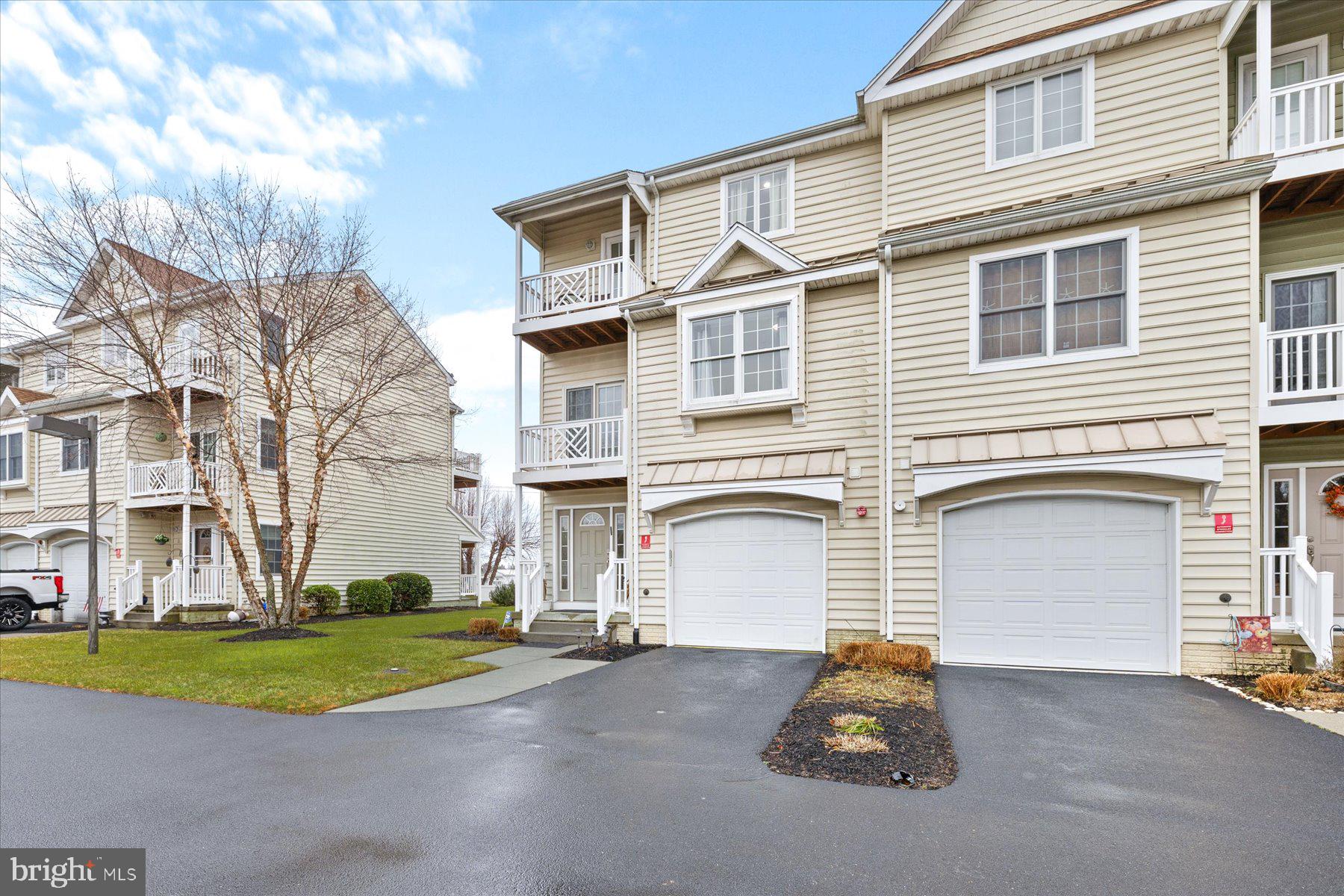 9823 Golf Course Road, Unit 10 Ocean City, MD 21842 - Photo 40 of 40 a small white building sitting on the side of a road