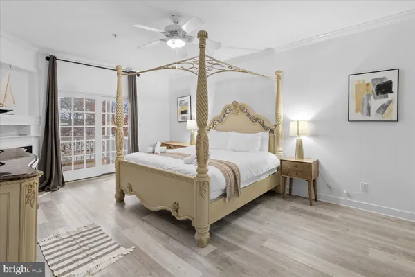 a bed room with a bed and a chair