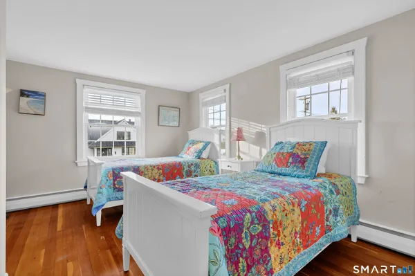 a bedroom with bed and a window