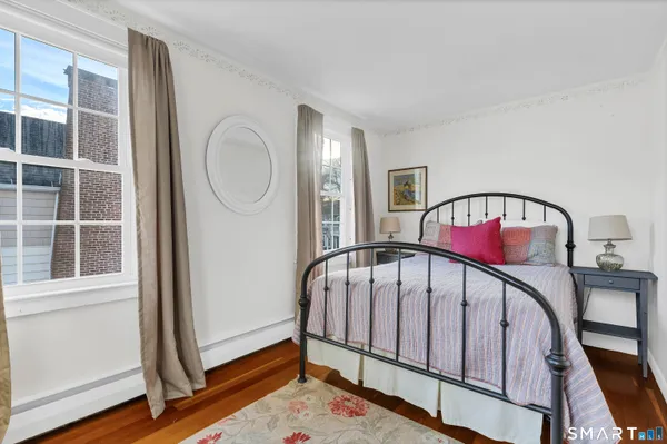 a view of staircase with rug