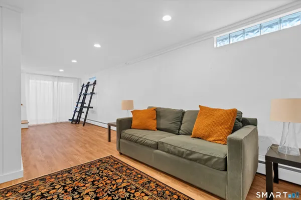 a living room with a couch and a rug
