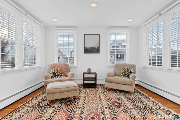 a living room with furniture and windows