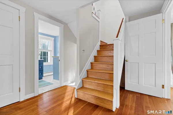 a view of entryway with wooden floor