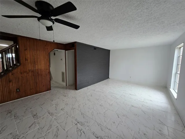 a view of a room with a hallway