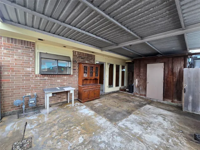 a view of a hallway with seating space
