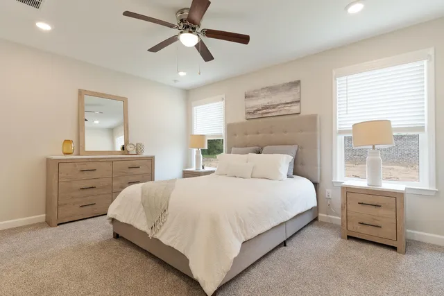 a bedroom with a bed and a dresser
