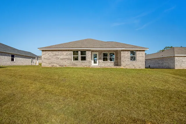 a view of yard with swimming pool and trees