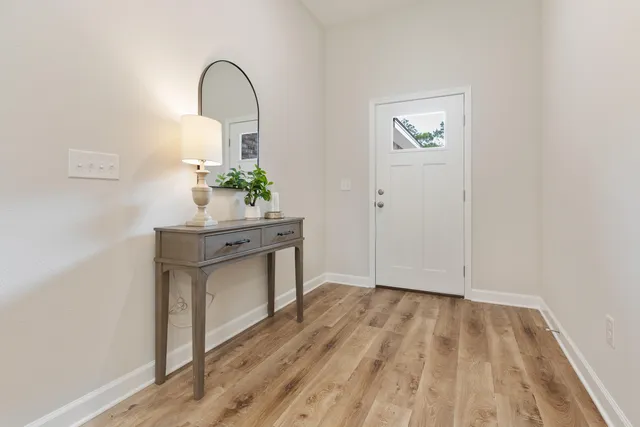 a room with a sink and a mirror