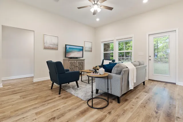 a living room with furniture and a large window