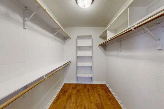 a view of an empty walk in closet