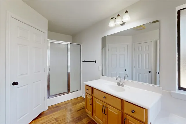 a bathroom with a sink double vanity and a mirror