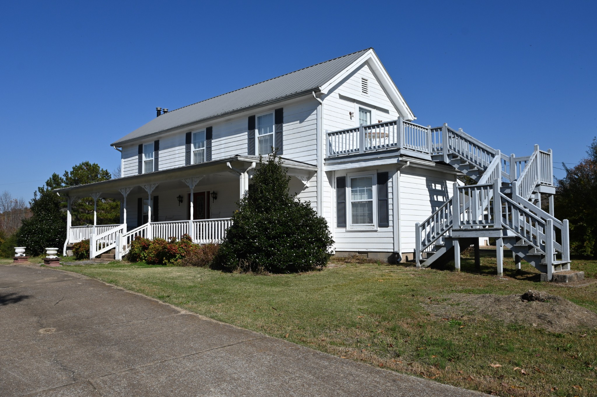 489 Doyle Road Linden, TN 37096 - Photo 1 of 70 a front view of a house with a yard
