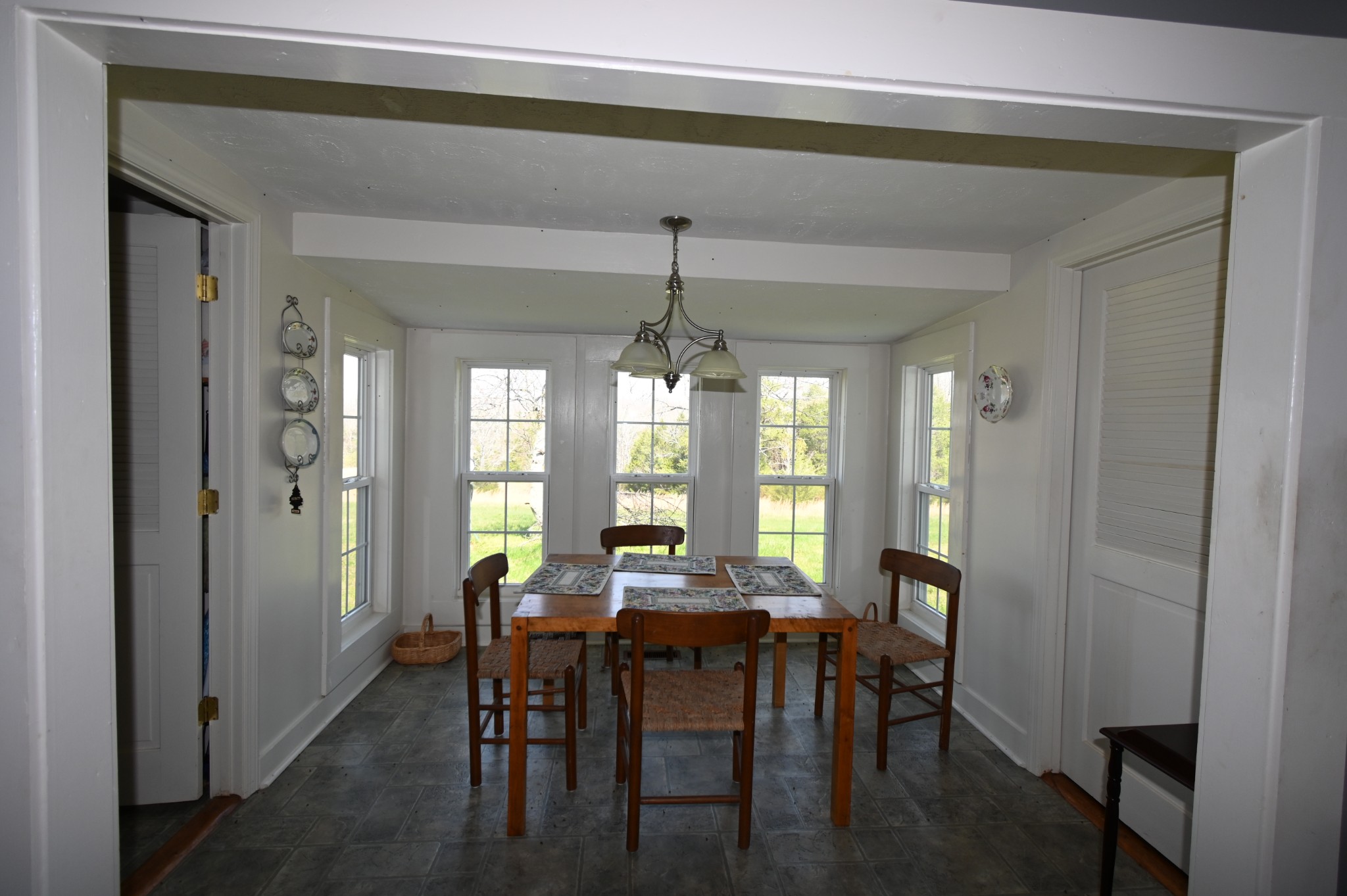 489 Doyle Road Linden, TN 37096 - Photo 11 of 70 a view of a a dining room with furniture window and wooden floor