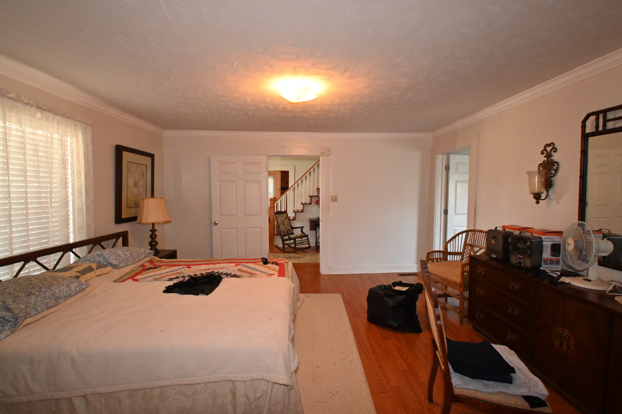 489 Doyle Road Linden, TN 37096 - Photo 14 of 70 a bedroom with a bed and a dresser