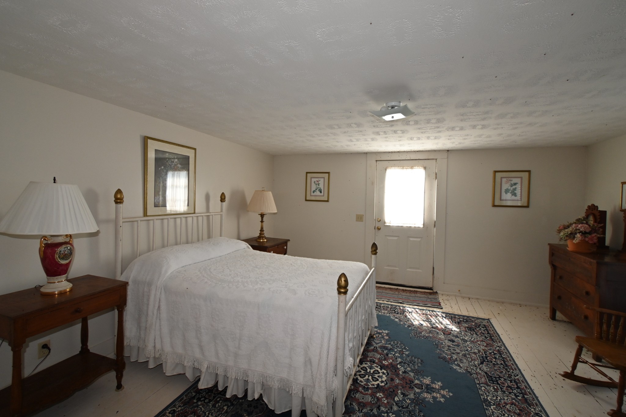 489 Doyle Road Linden, TN 37096 - Photo 19 of 70 a bedroom with a bed and wooden floor