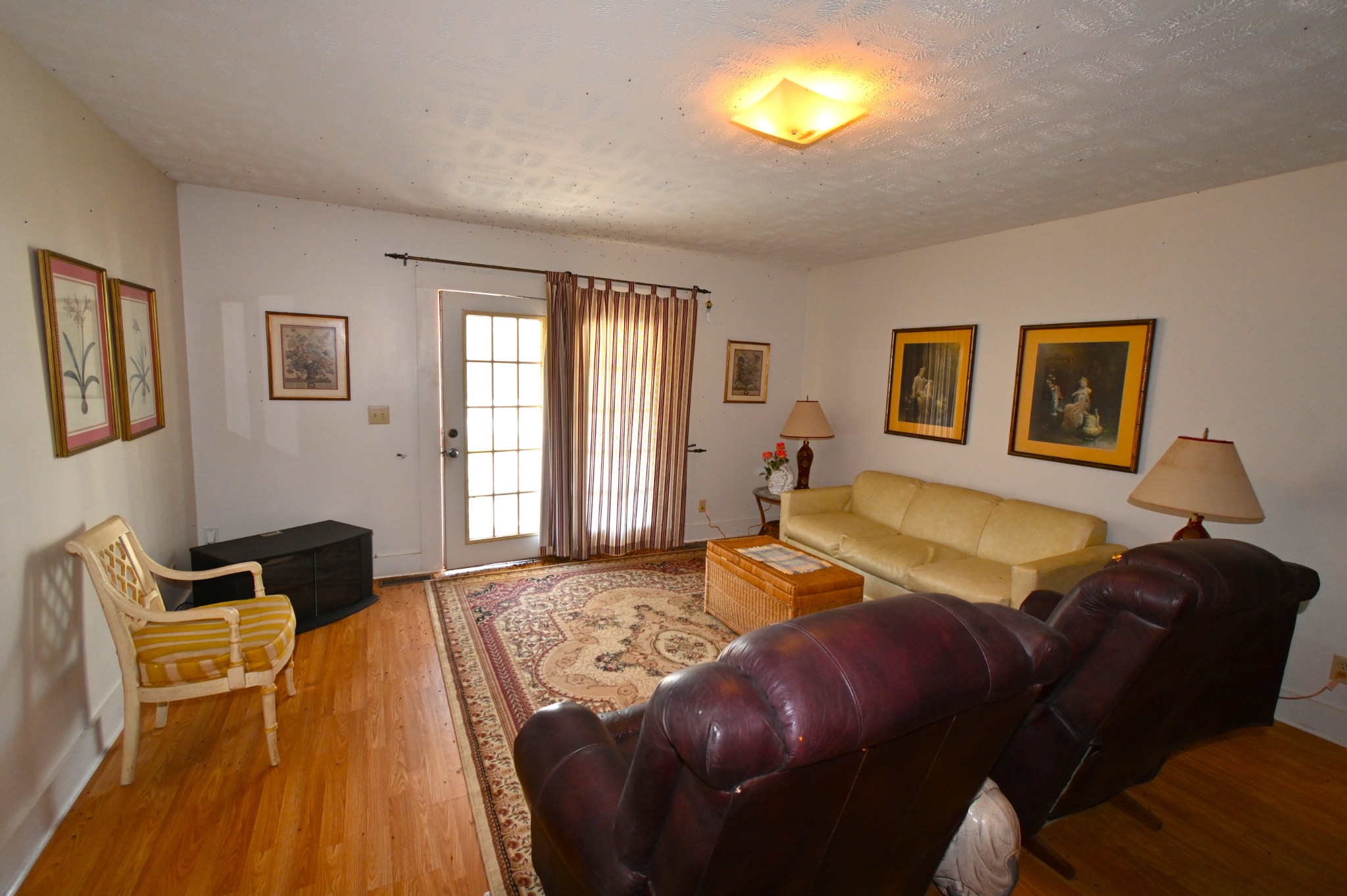 489 Doyle Road Linden, TN 37096 - Photo 26 of 70 a bedroom with a bed and wooden floor