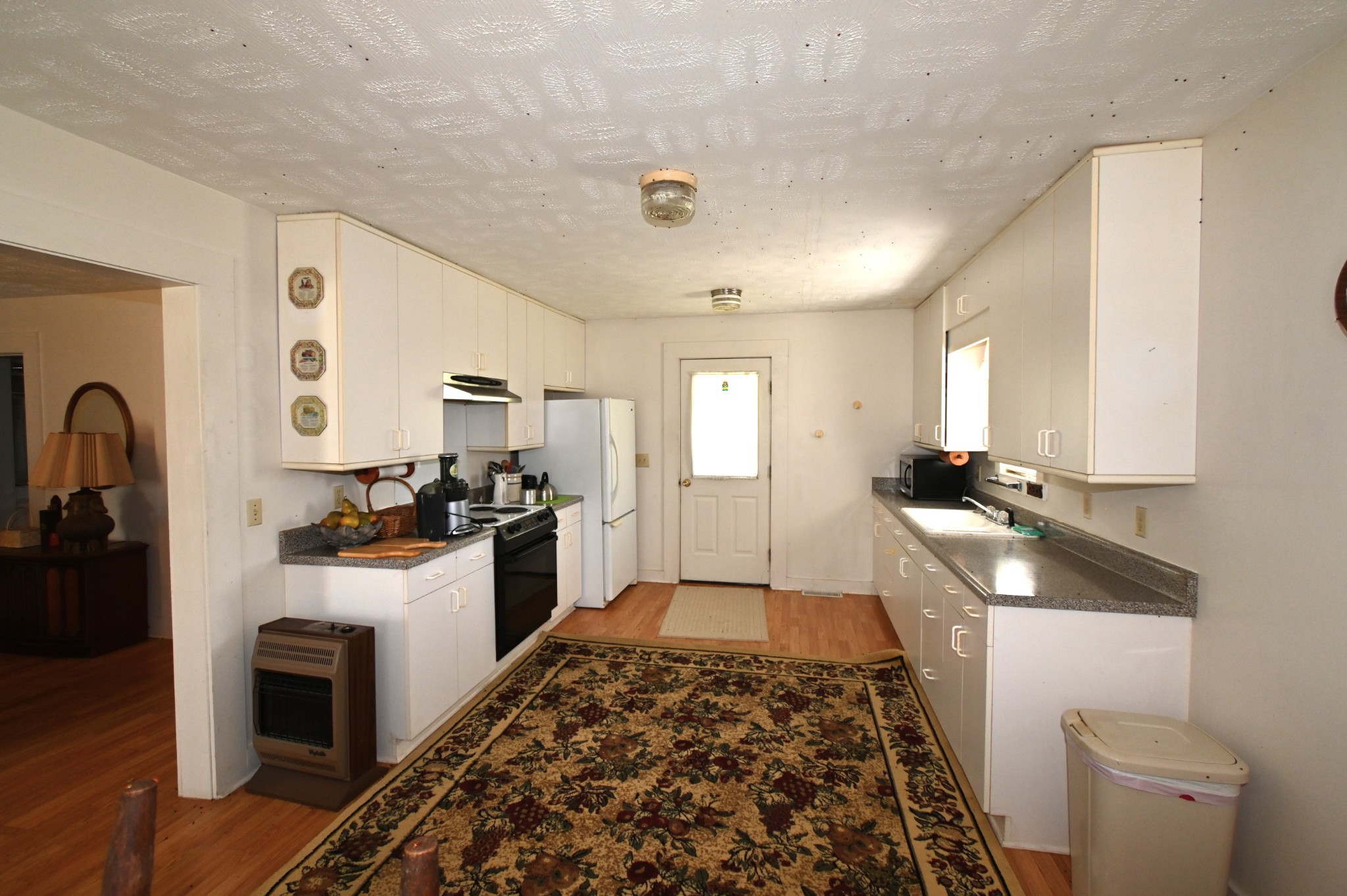 489 Doyle Road Linden, TN 37096 - Photo 28 of 70 a kitchen with a sink and a stove top oven
