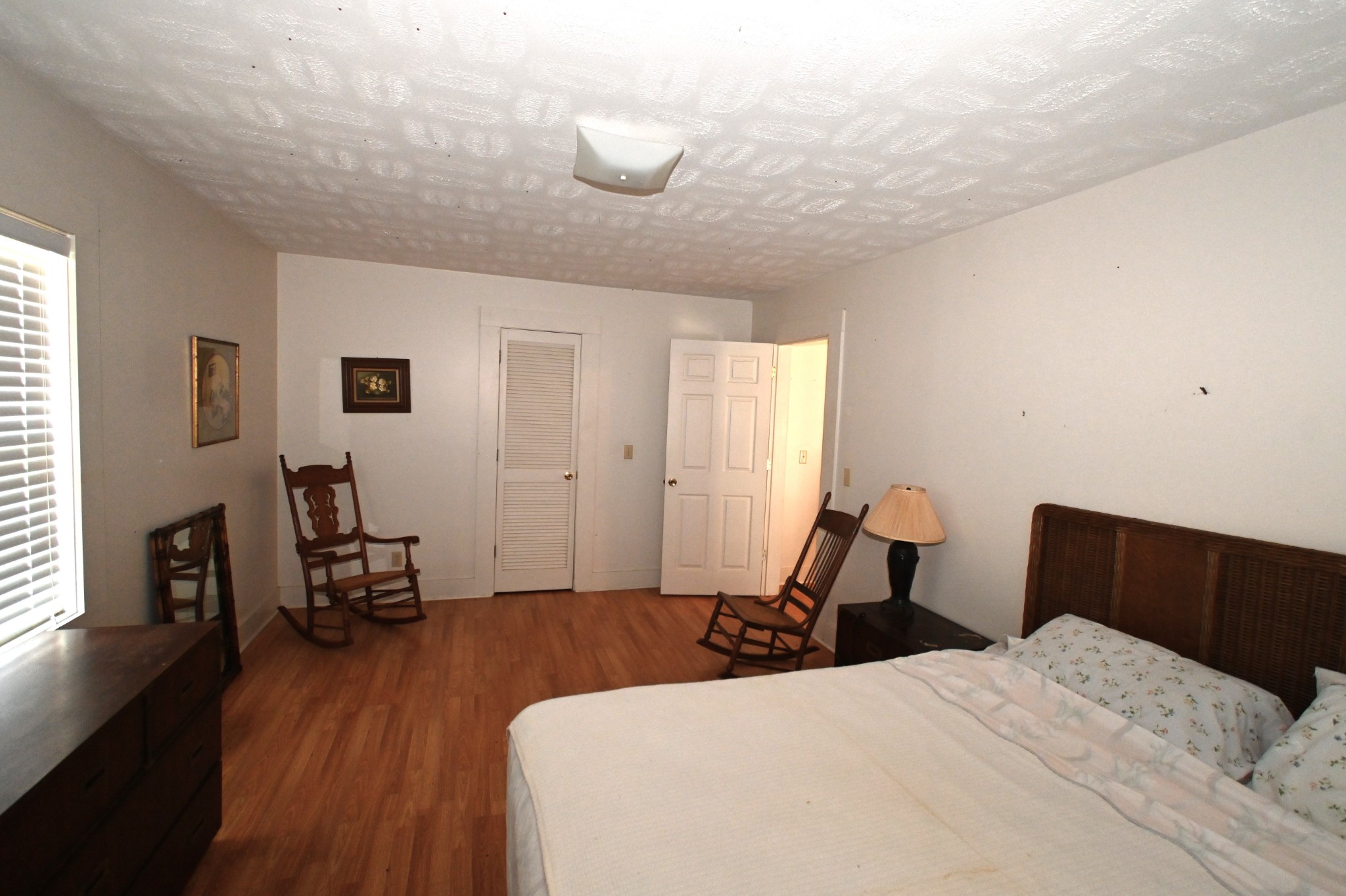 489 Doyle Road Linden, TN 37096 - Photo 33 of 70 a bedroom with bed and wooden floor