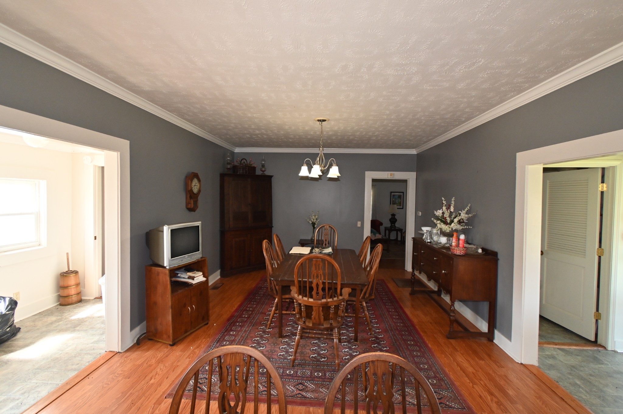 489 Doyle Road Linden, TN 37096 - Photo 10 of 70 a view of a dining room with furniture a chandelier and wooden floor