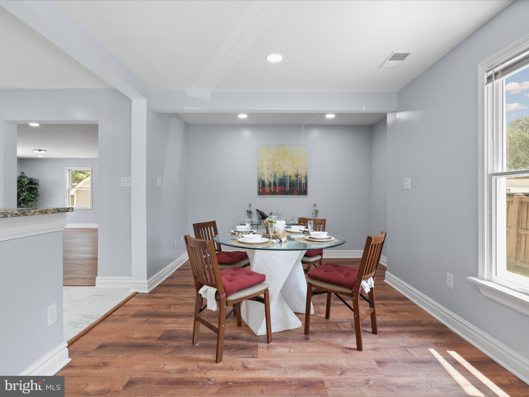 8211 Hocking Place Alexandria, VA 22309 - Photo 11 of 45 a view of a dining room with furniture and wooden floor