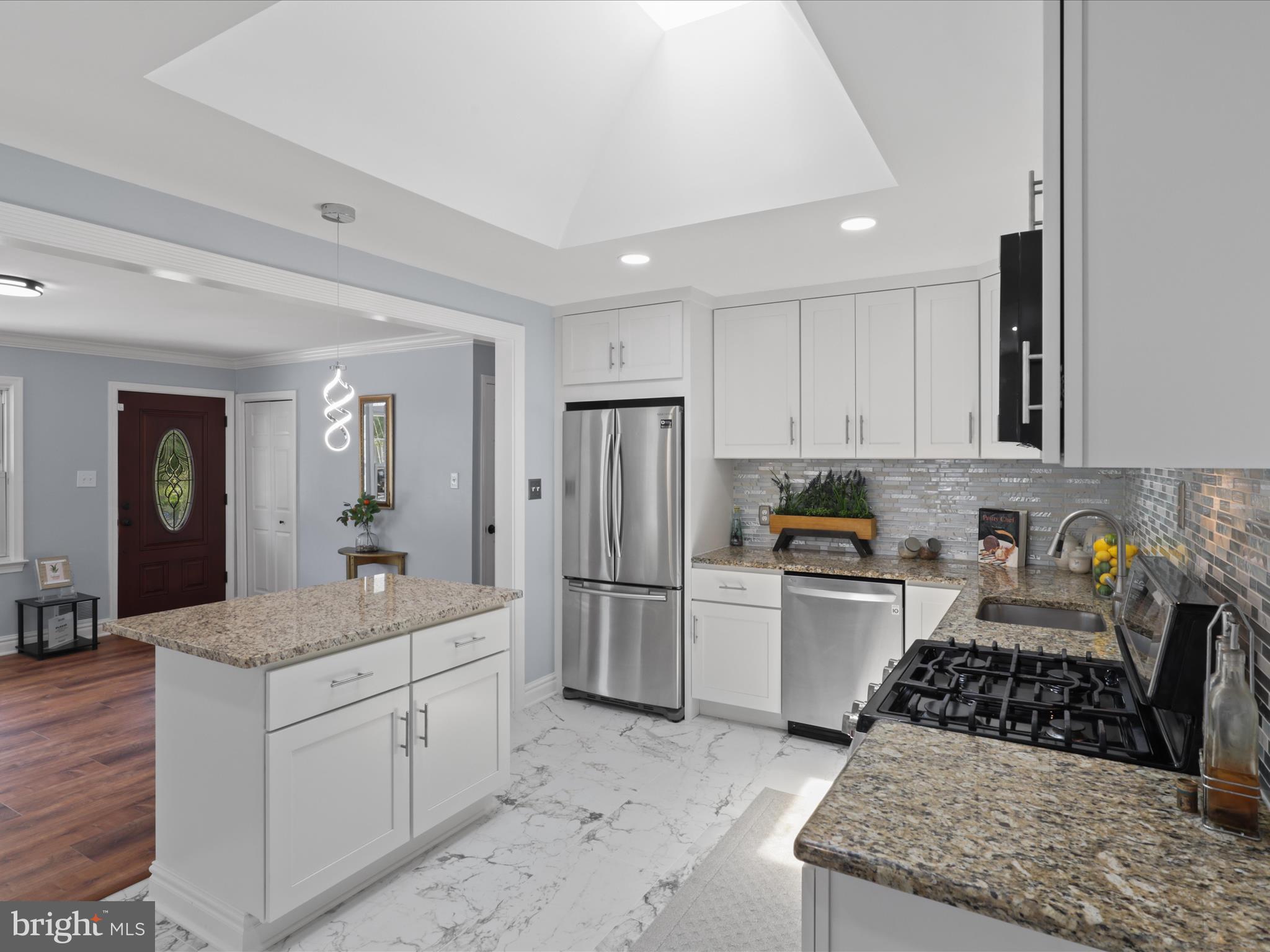 8211 Hocking Place Alexandria, VA 22309 - Photo 14 of 45 a kitchen with a sink stove and refrigerator