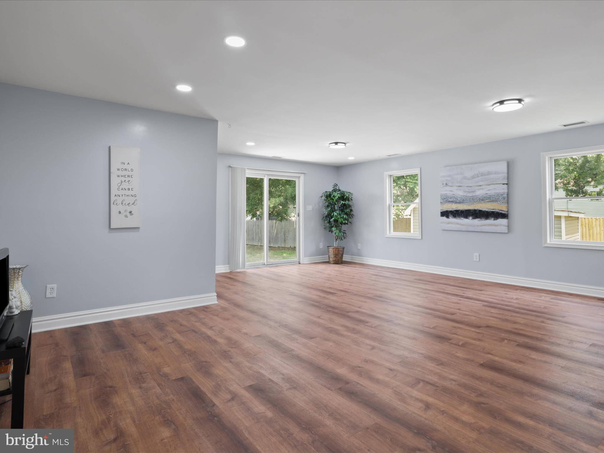 8211 Hocking Place Alexandria, VA 22309 - Photo 15 of 45 a view of an empty room with a window and wooden floor