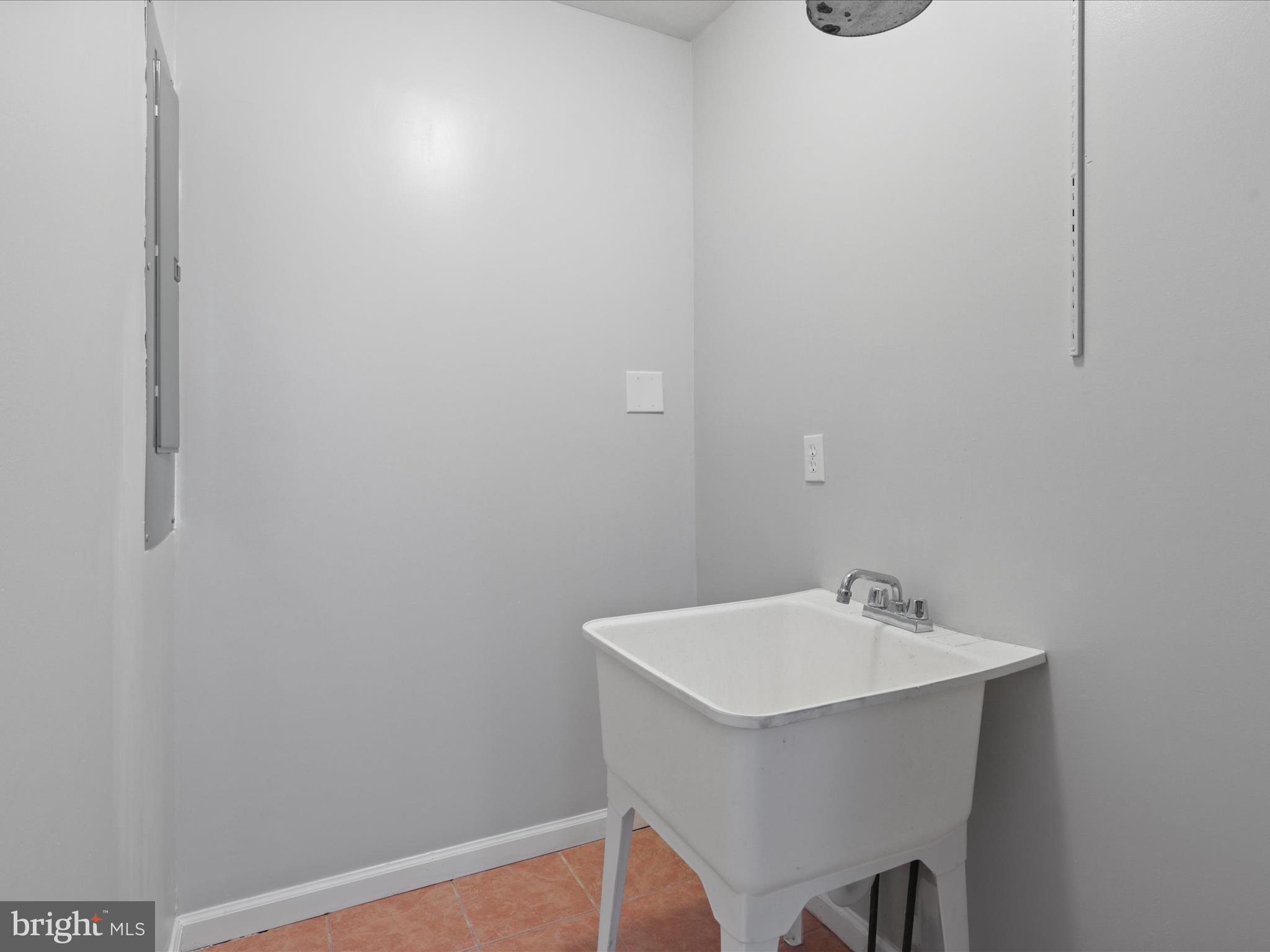 8211 Hocking Place Alexandria, VA 22309 - Photo 20 of 45 a bathroom with a sink and mirror