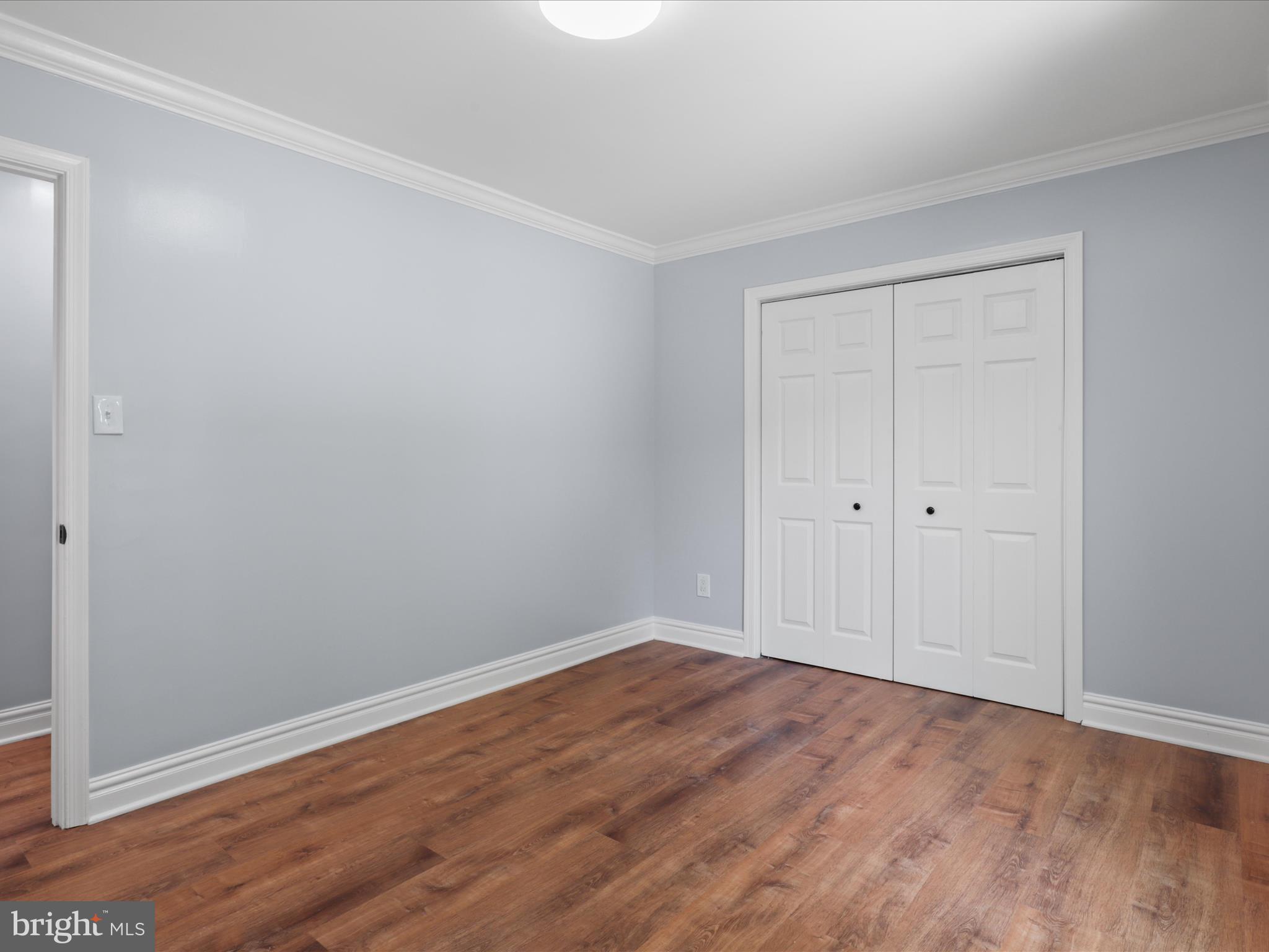 8211 Hocking Place Alexandria, VA 22309 - Photo 29 of 45 a view of empty room with wooden floor