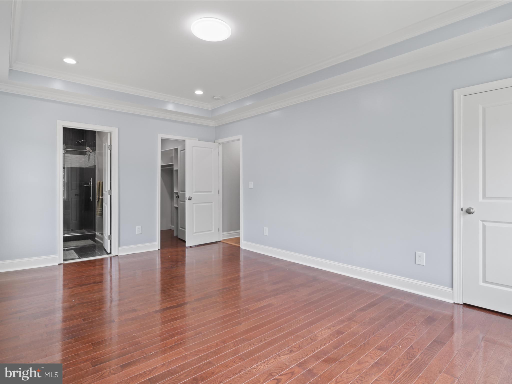 8211 Hocking Place Alexandria, VA 22309 - Photo 32 of 45 a view of an empty room with wooden floor and closet