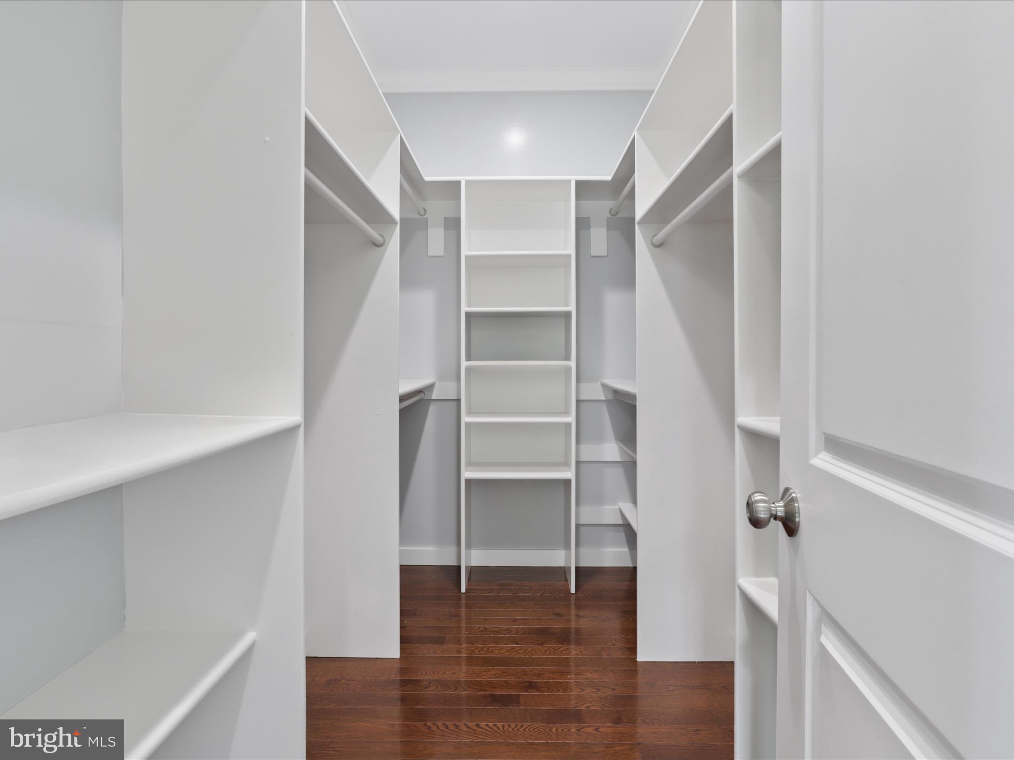 8211 Hocking Place Alexandria, VA 22309 - Photo 33 of 45 a view of walk in closet with empty racks