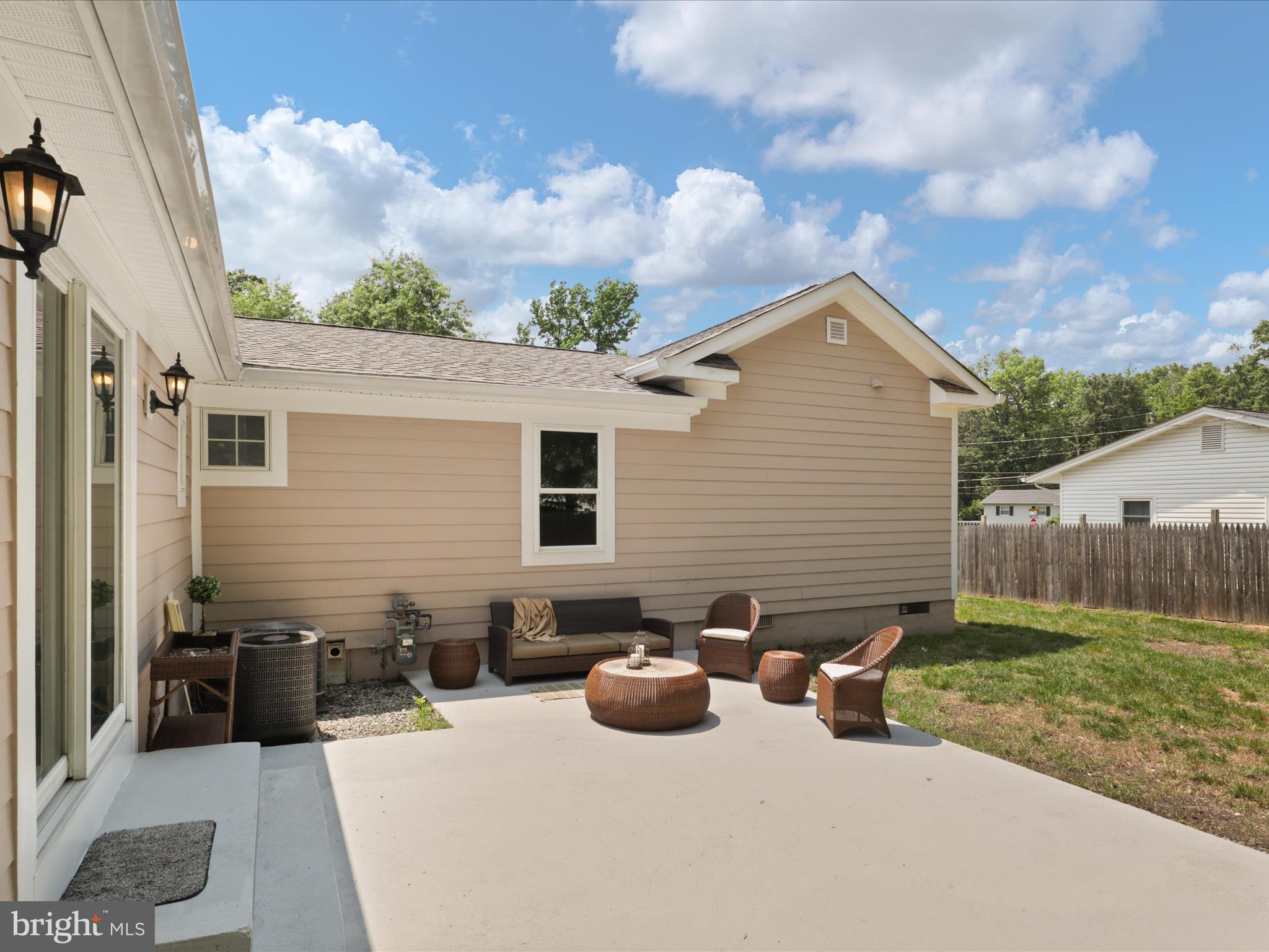 8211 Hocking Place Alexandria, VA 22309 - Photo 35 of 45 a view of backyard of house with seating space