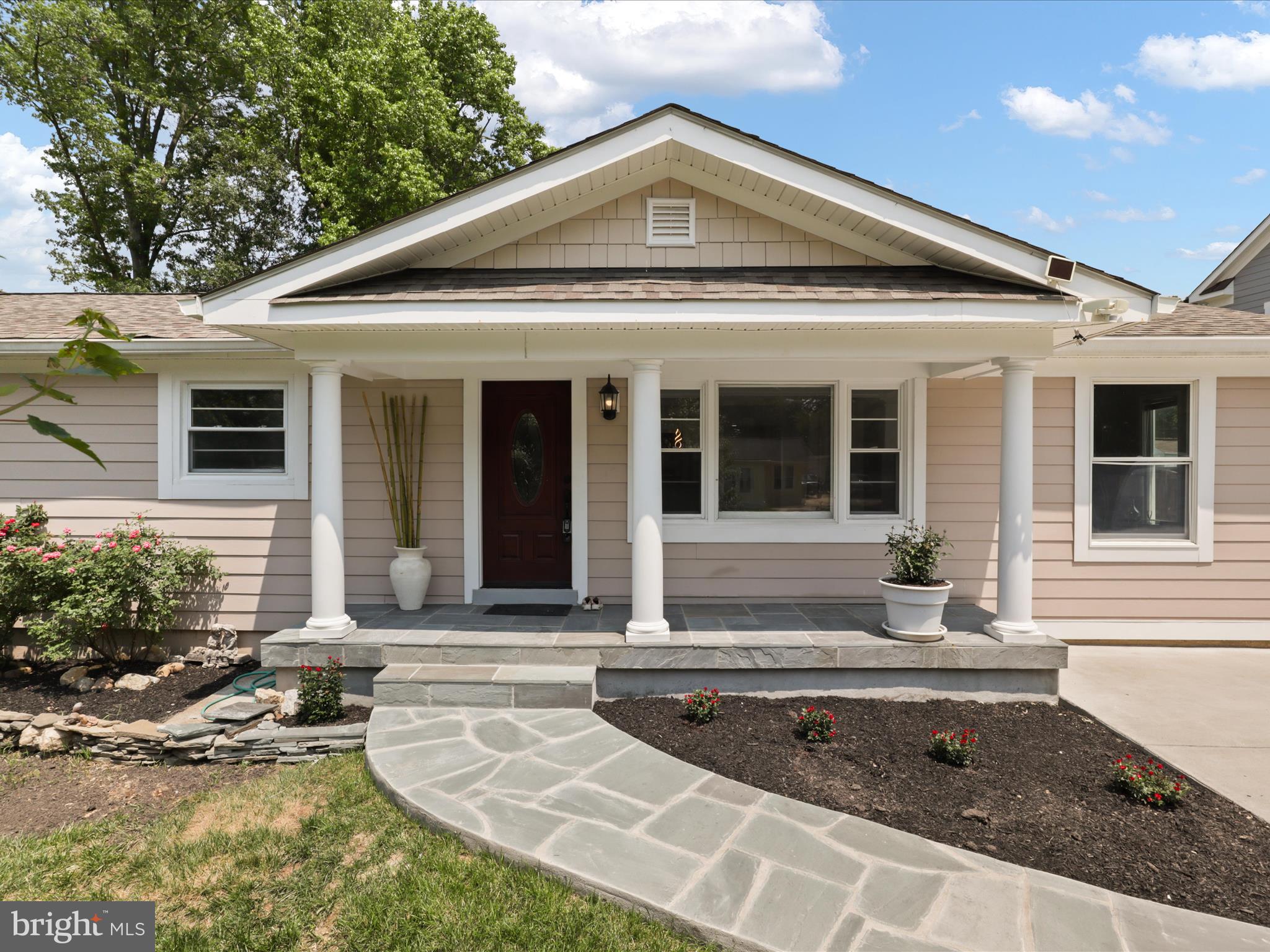 8211 Hocking Place Alexandria, VA 22309 - Photo 5 of 45 a view of a house with sitting area and garden