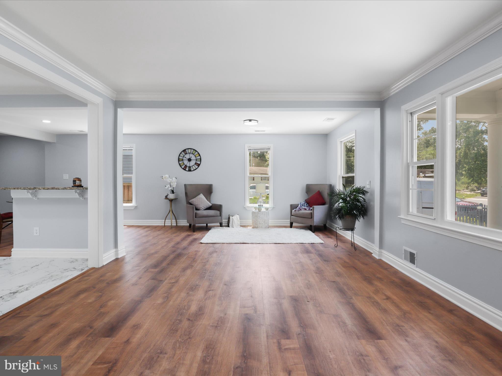 8211 Hocking Place Alexandria, VA 22309 - Photo 8 of 45 a living room with furniture and a wooden floor