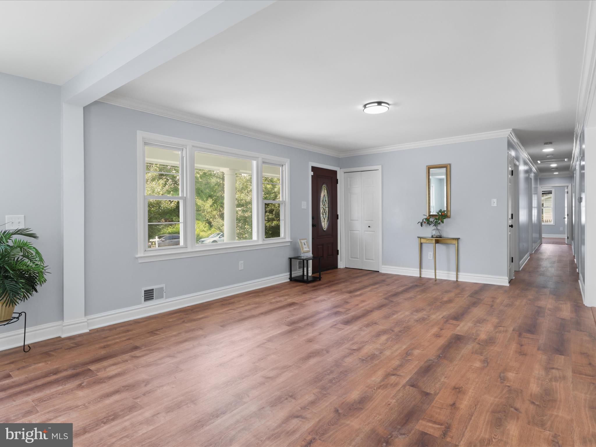 8211 Hocking Place Alexandria, VA 22309 - Photo 10 of 45 a view of empty room with wooden floor and fan