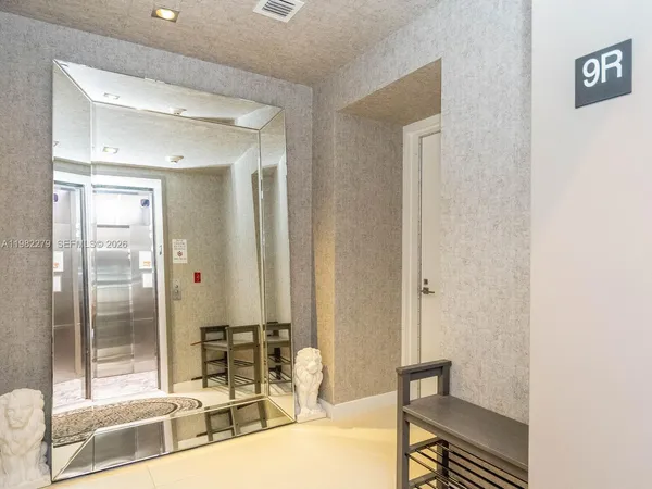 a bathroom with a tub and shower