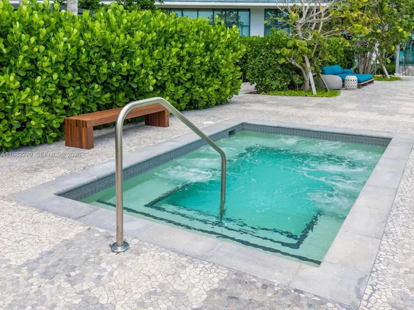 a view of a wooden door and a yard