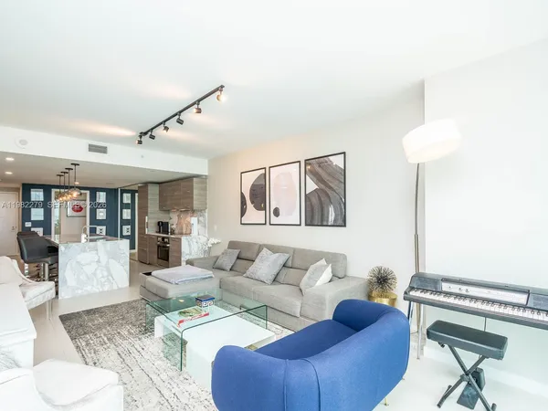 a living room with furniture and a rug