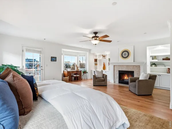 a bedroom with furniture and a fireplace